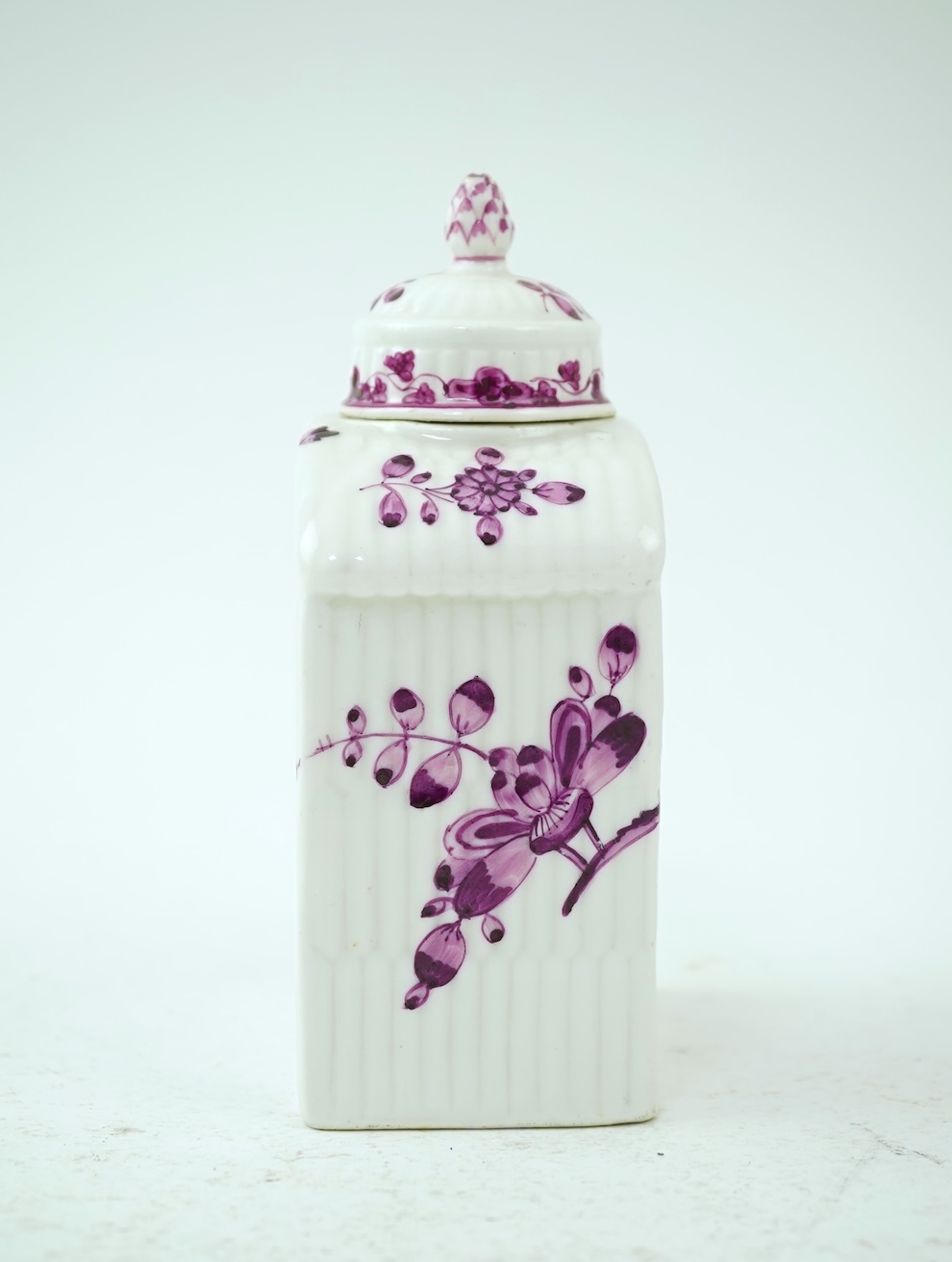 A Meissen puce painted tea caddy and cover, late 18th century